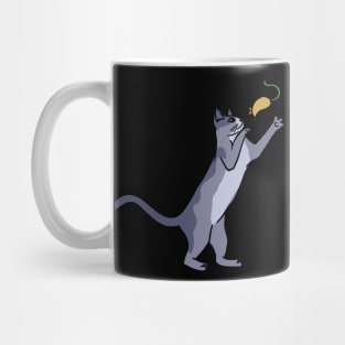 A cute cat playing with a mouse Mug